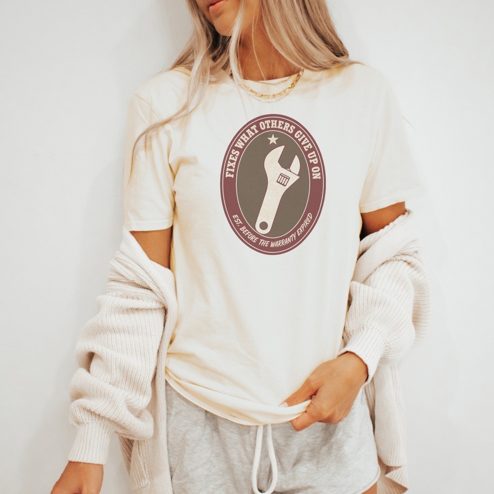 Fixes What Others Give Up On Wrench Badge Tee